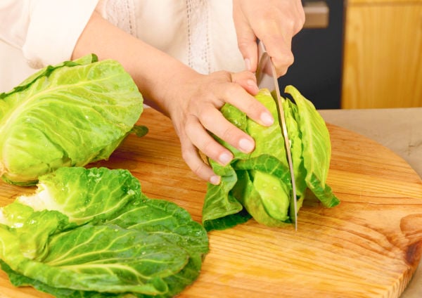 Chopping cabbage on a board