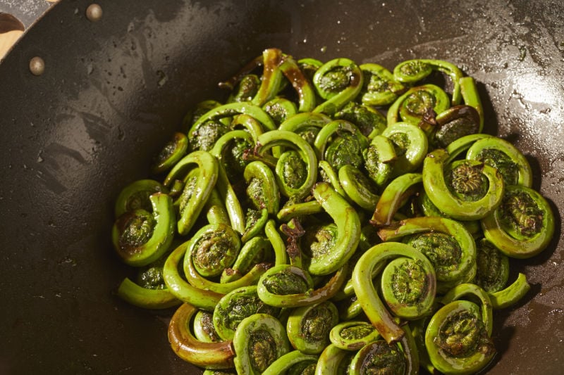 Sauteed Fiddleheads in a wok