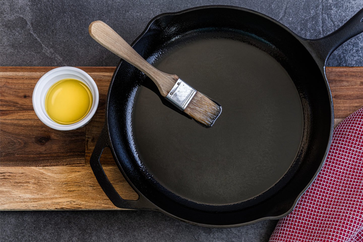 Brushing Oil On Cast Iron Skillet