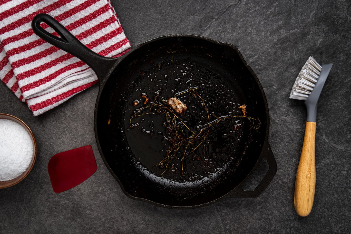 Cleaning Dirty Cast Iron Skillet With Brush