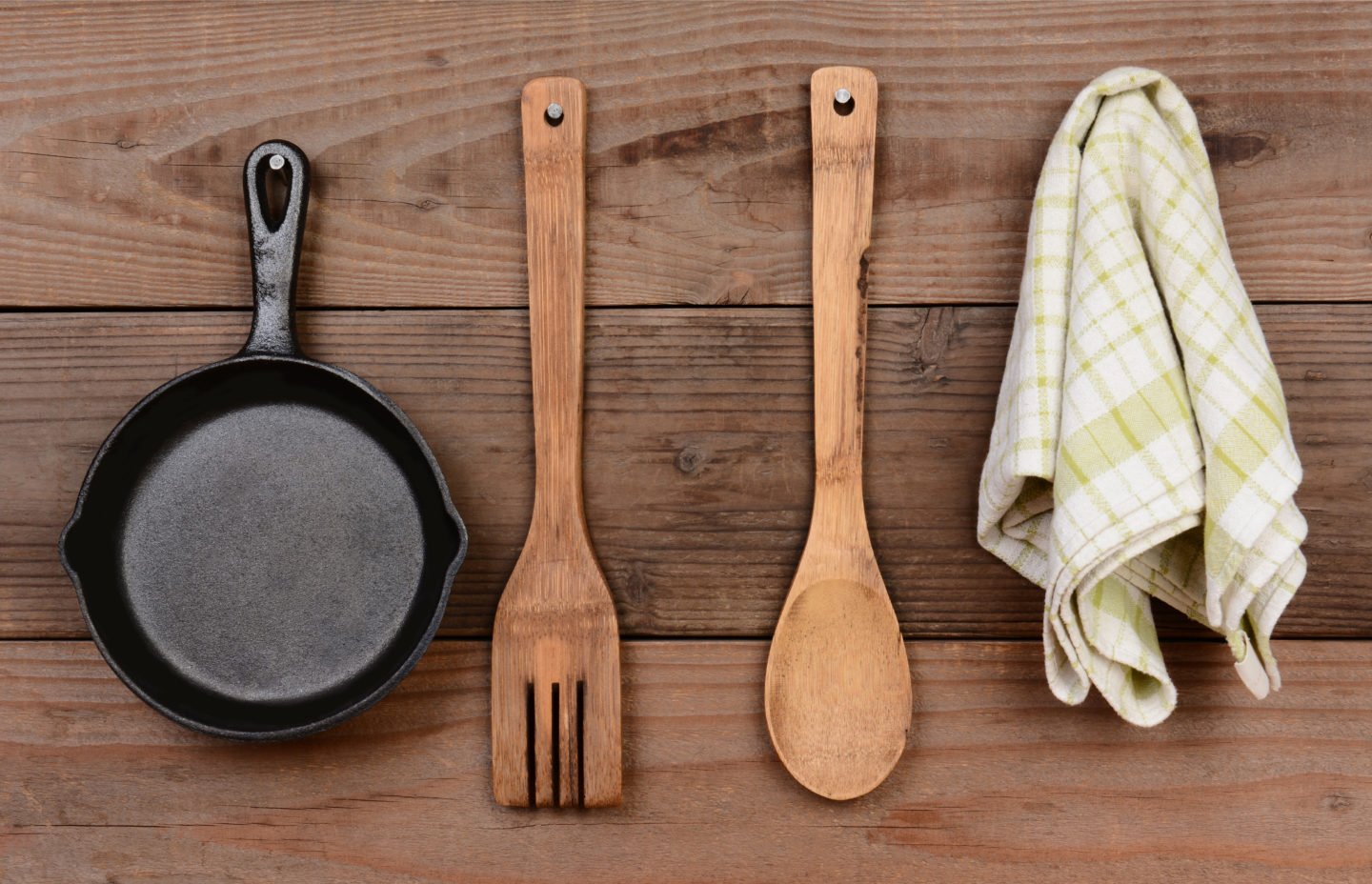 Hanging Cast Iron Pan With Wooden Utensils