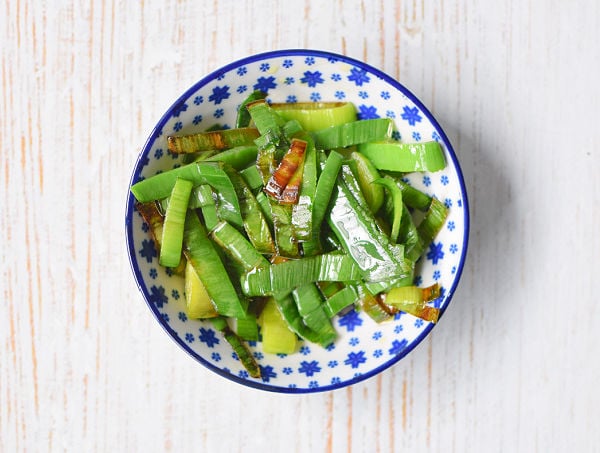 Fried leek leaves in a bowl from above