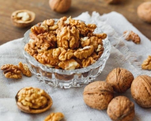 Glass bowl with walnuts