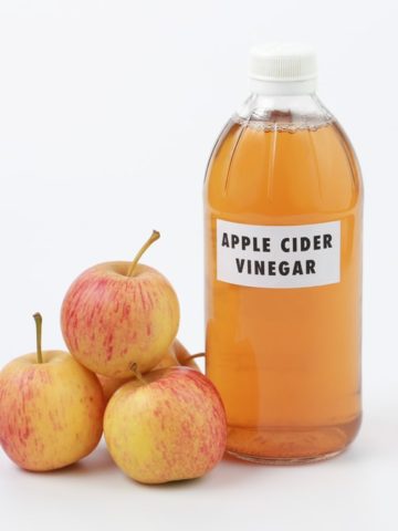 Apple Cider Vinegar In Glass Bottle And Ripe Fresh Apples