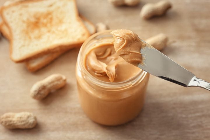 creamy peanut butter with a knife