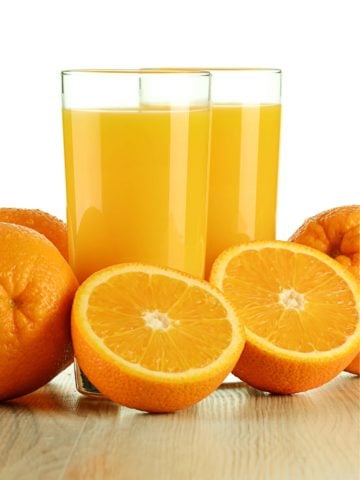 orange juice in drinking glasses