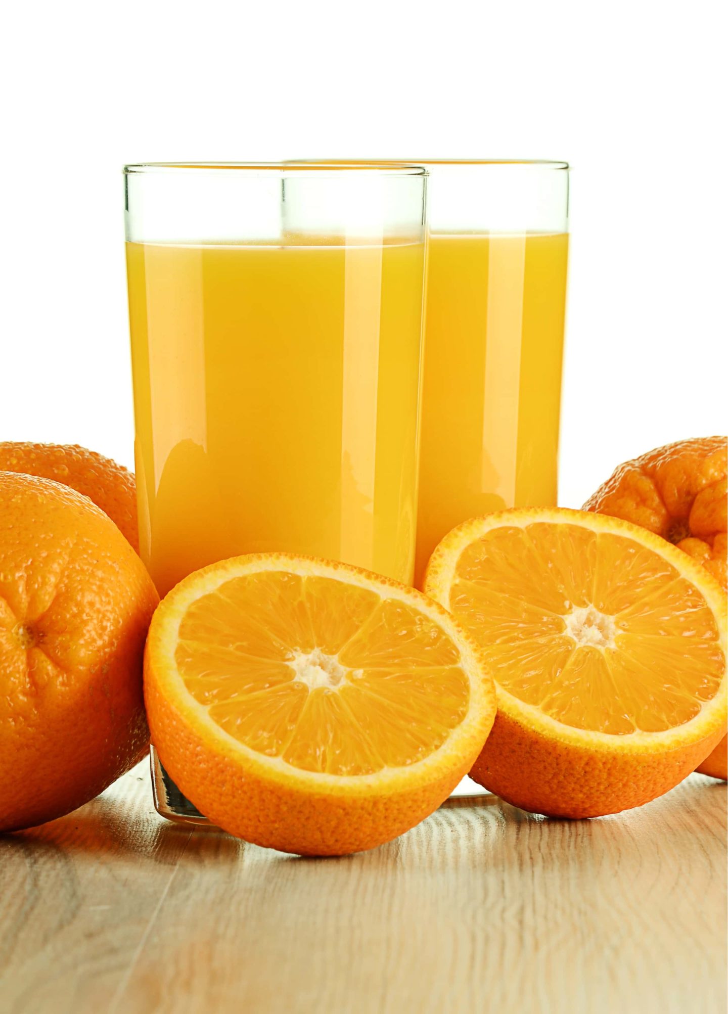 orange juice in drinking glasses