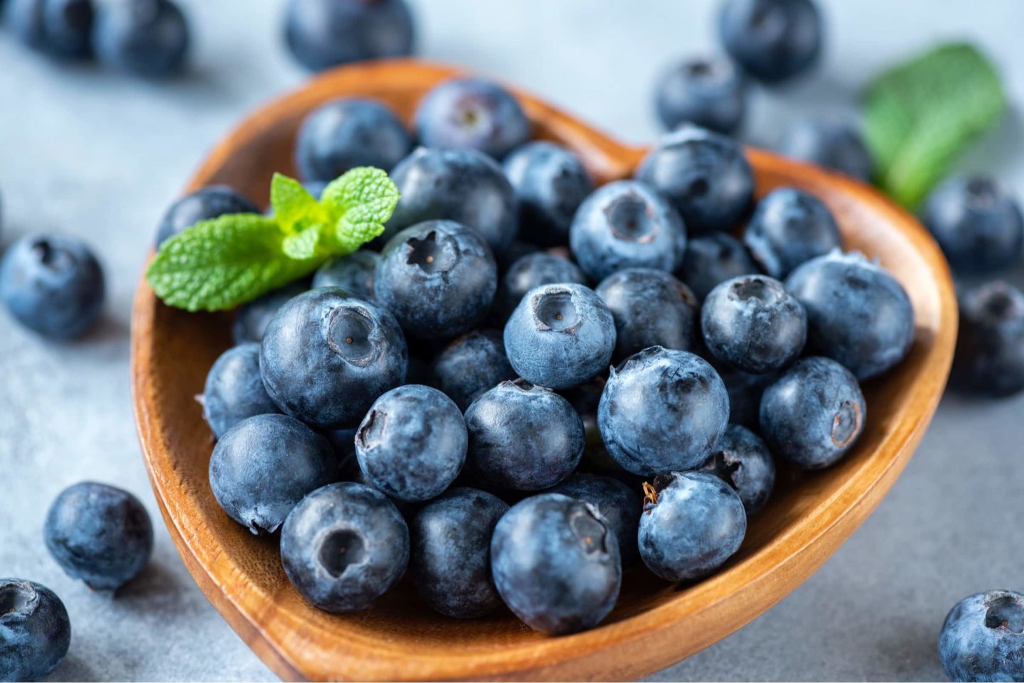 organic blueberries in a heart shaped bowl