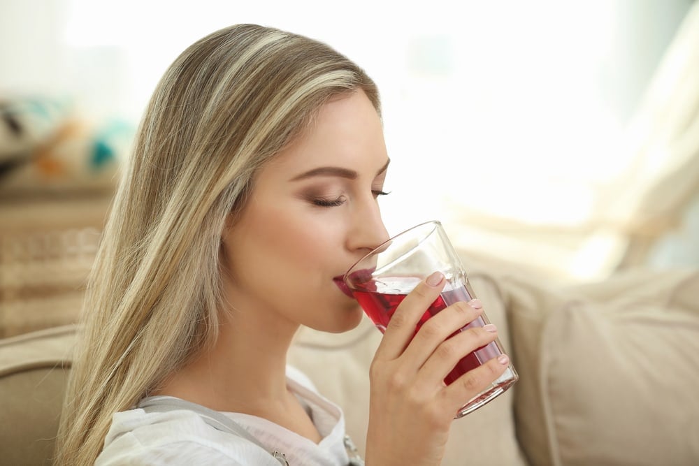 Woman Drinking Cranberry Juice