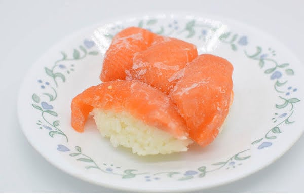 Frozen salmon nigiri on a plate