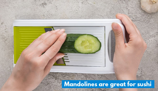 Slicing cucumber on a mandoline top down