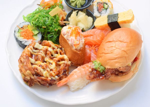 Various types of sushi on a white plate