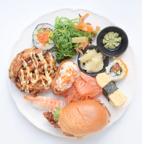 A large plate of various sushi varieties