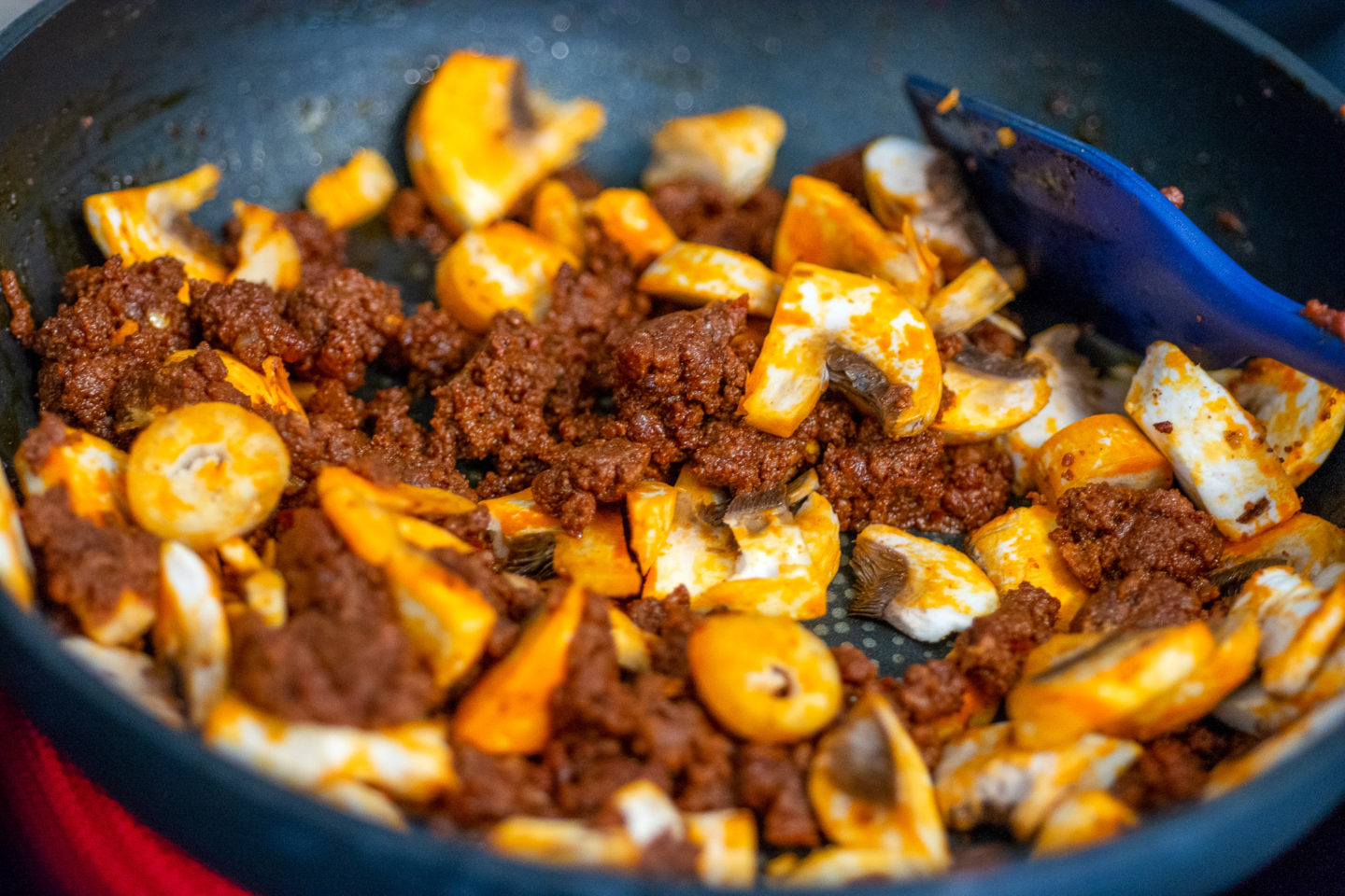 cooking keto chorizo and eggs in a pan