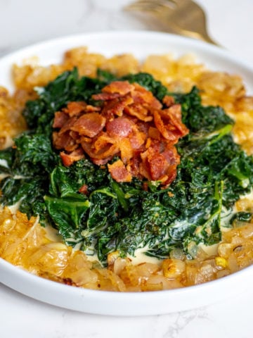 a bowl of sauteed keto kale with bacon and caramelized onions