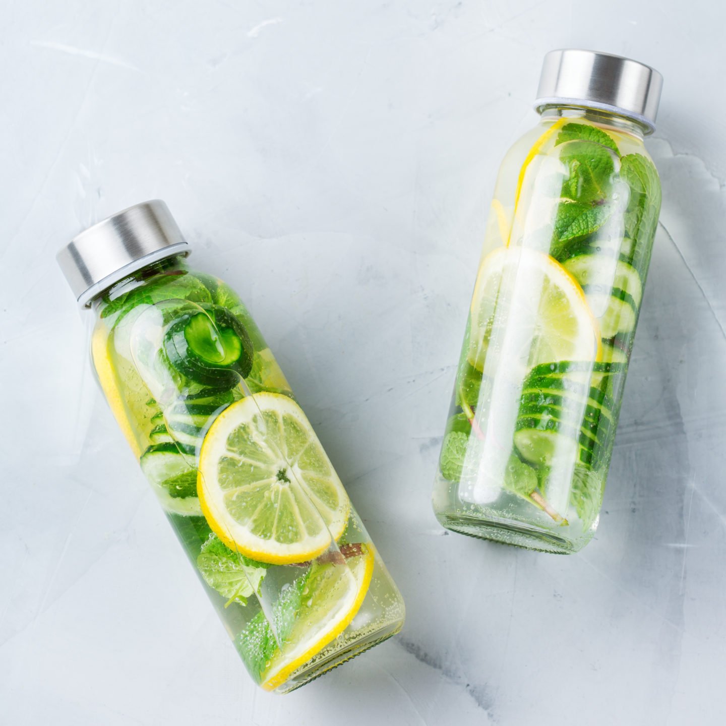 bottled lemon and lime juice on table