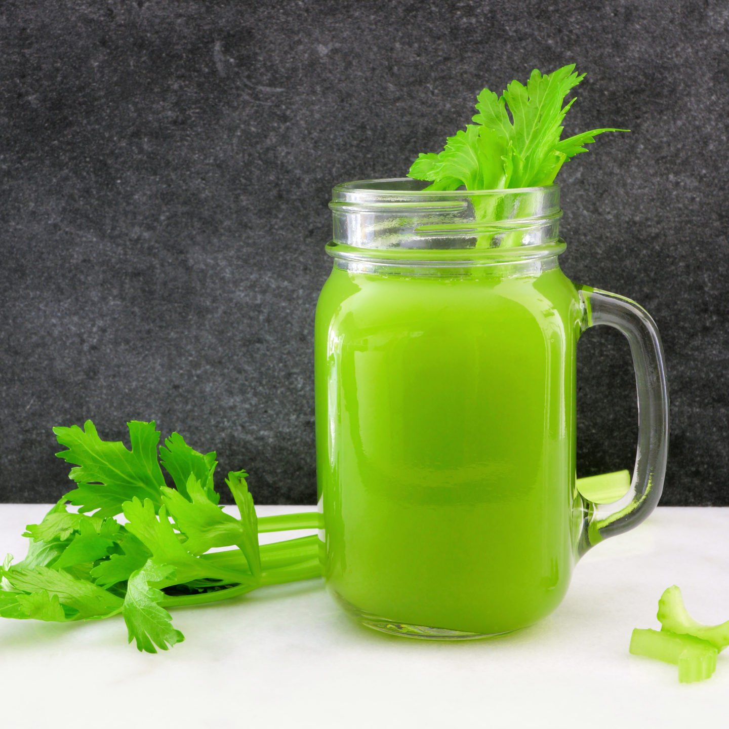 celery juice in a glass mason jar