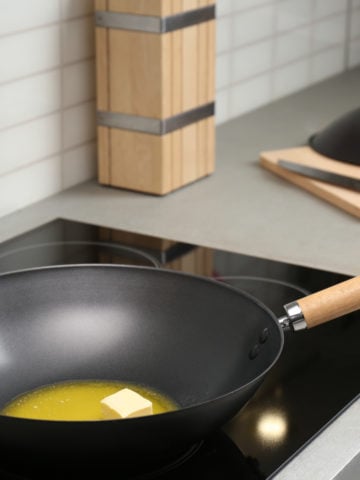 a flat bottom wok pan on electric stove or induction cooktop