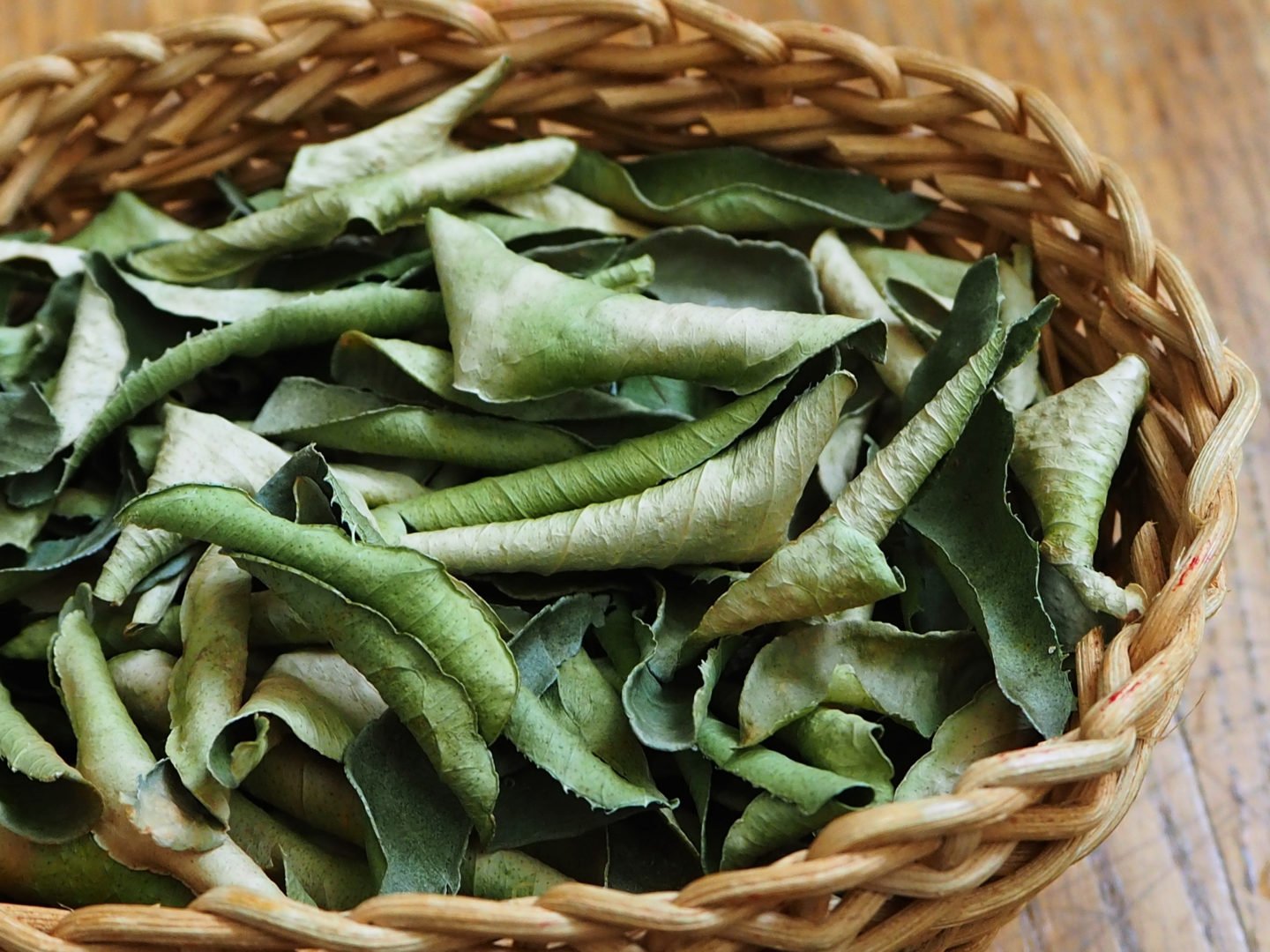 dried kaffir lime leaves in basket