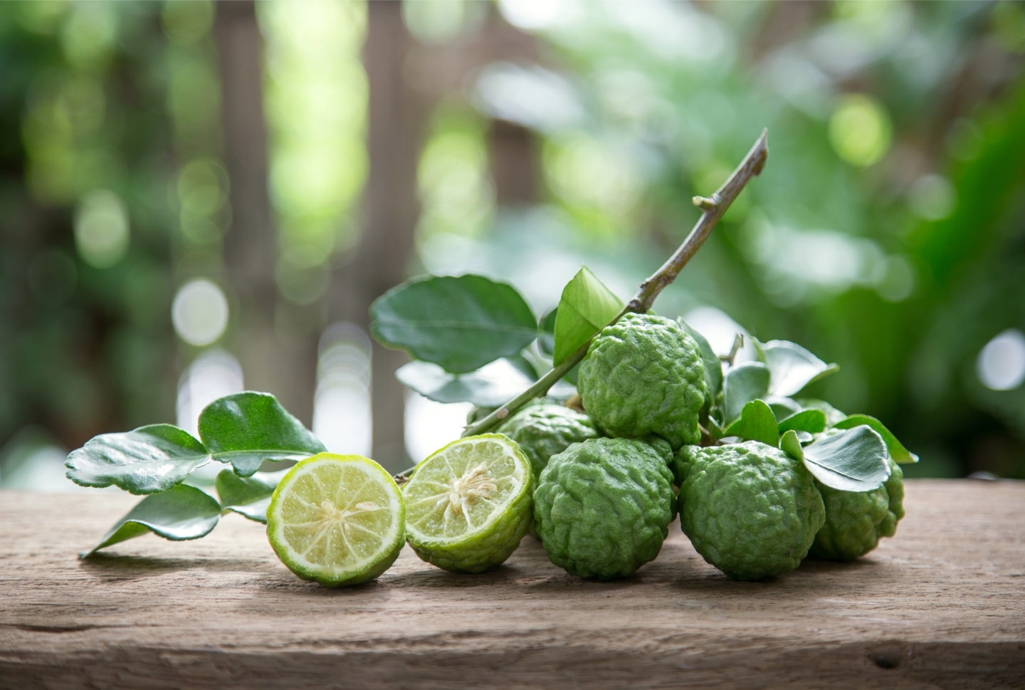 kaffir limes on wooden table