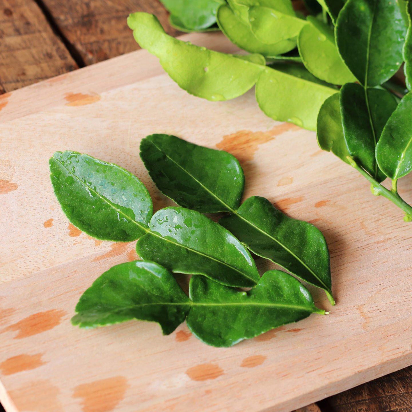 kaffir lime leaves on chopping board