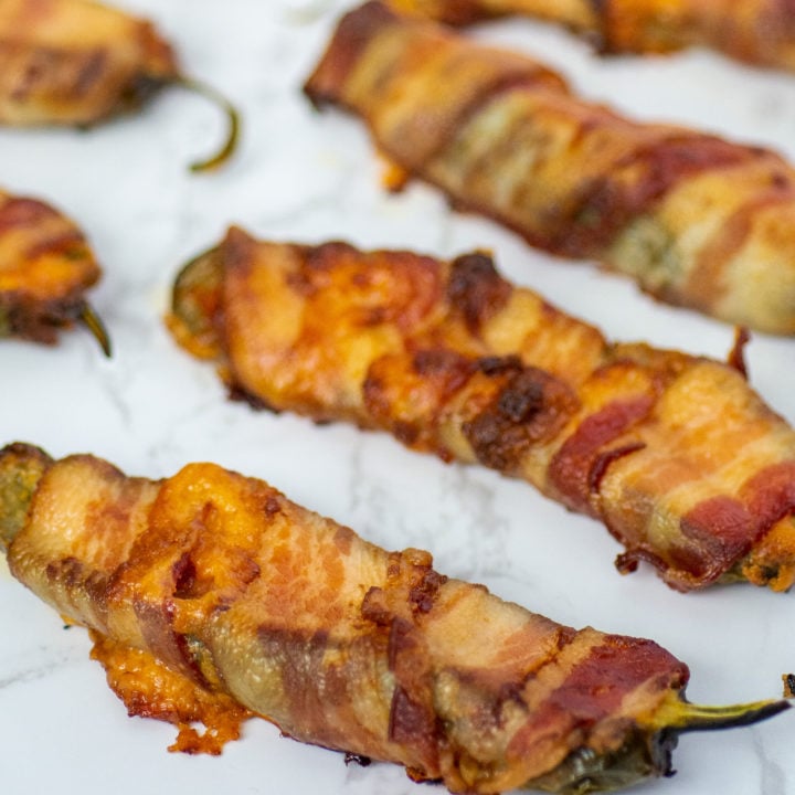 keto pimento cheese poppers are bacon-wrapped individually