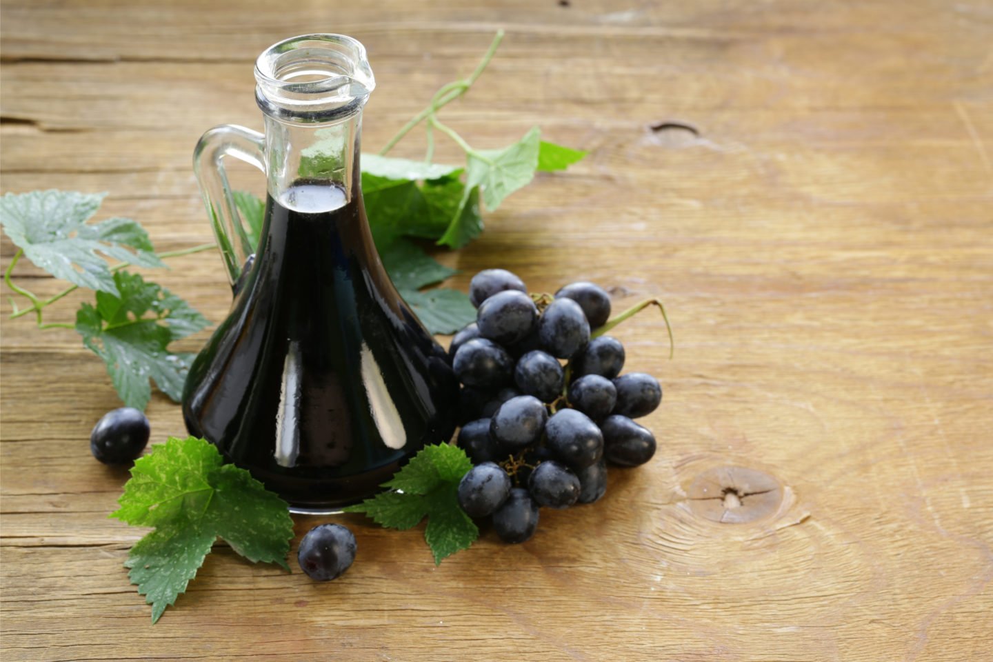 balsamic vinegar beside grapes