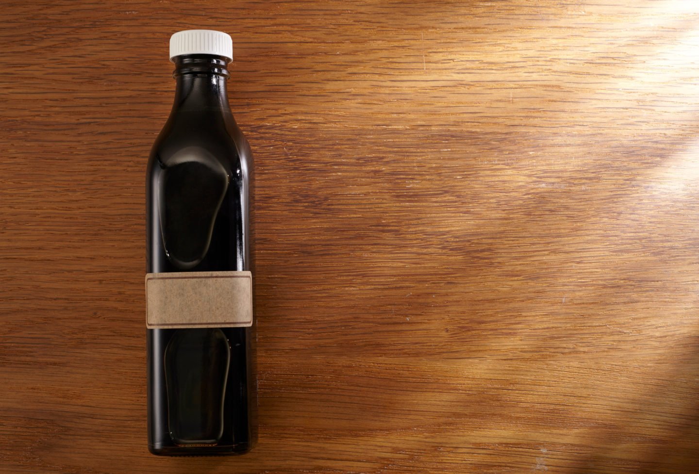 bottle of black vinegar on table