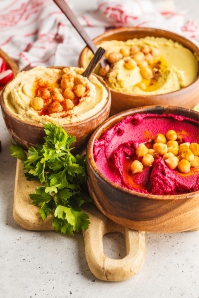 Chickpea hummus, avocado hummus and beetroot hummus