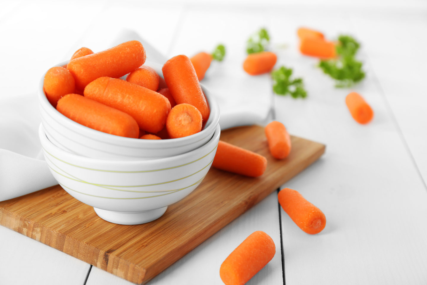 baby carrots in white bowl