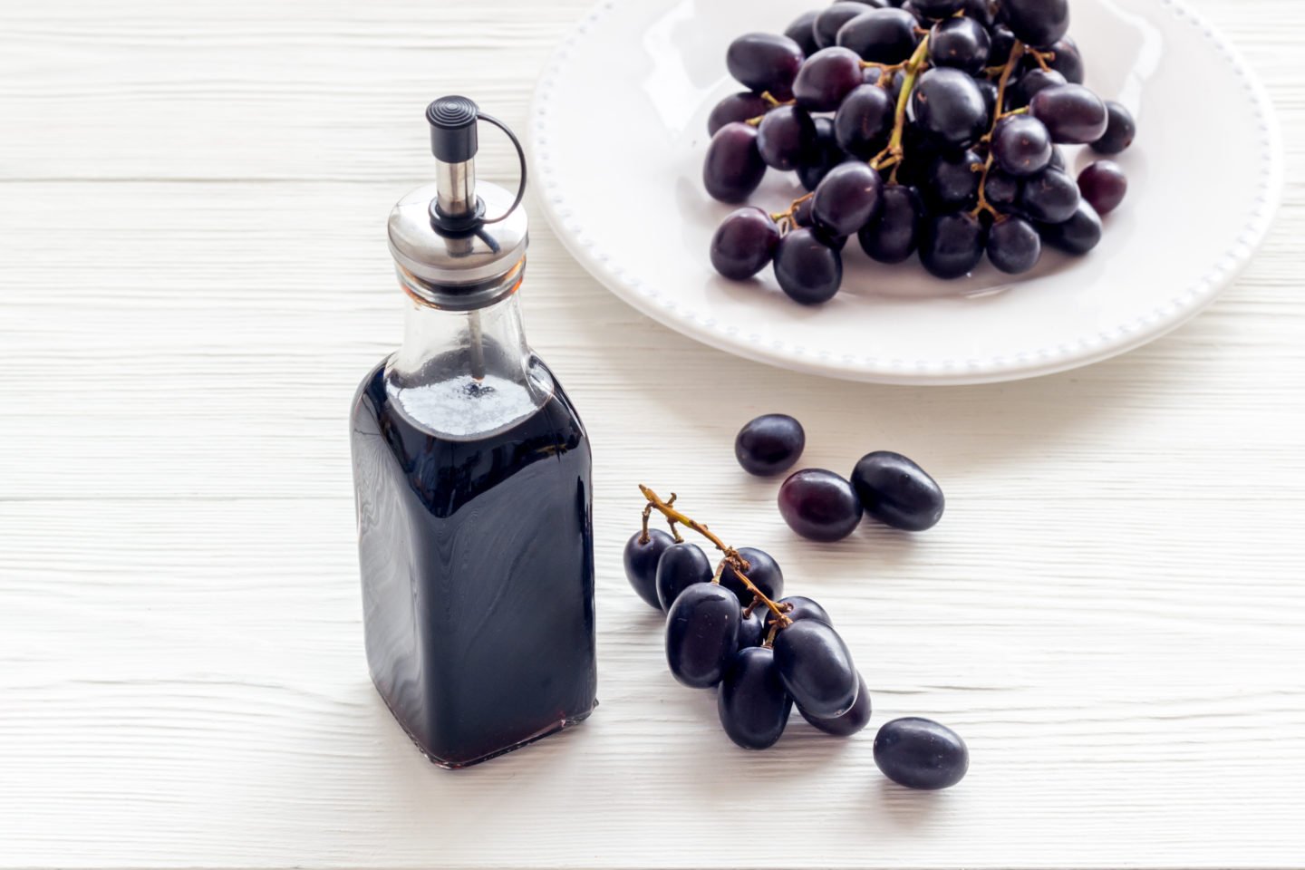 balsamic vinegar bottle and fresh grapes