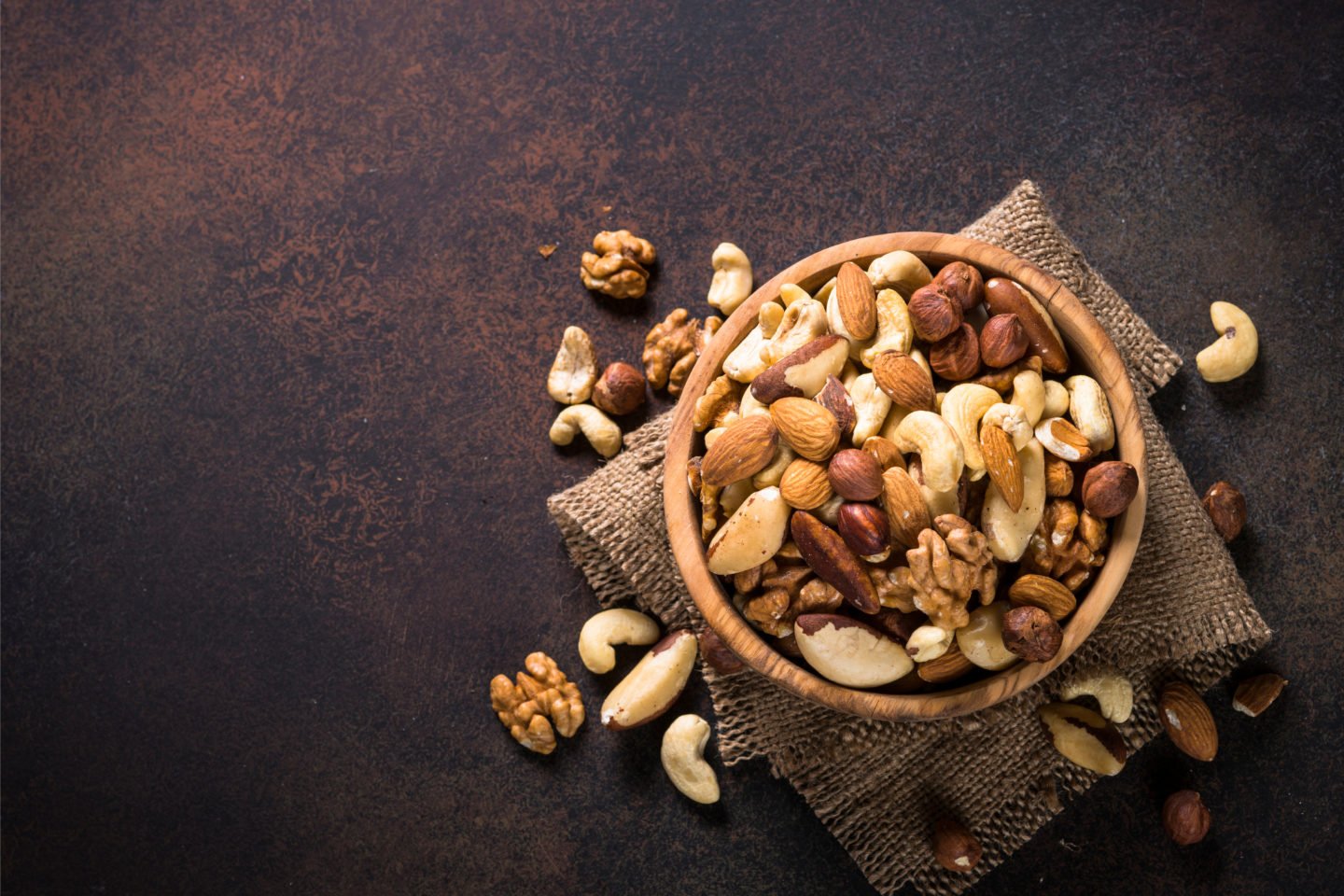 mixed nuts in small wooden bowl