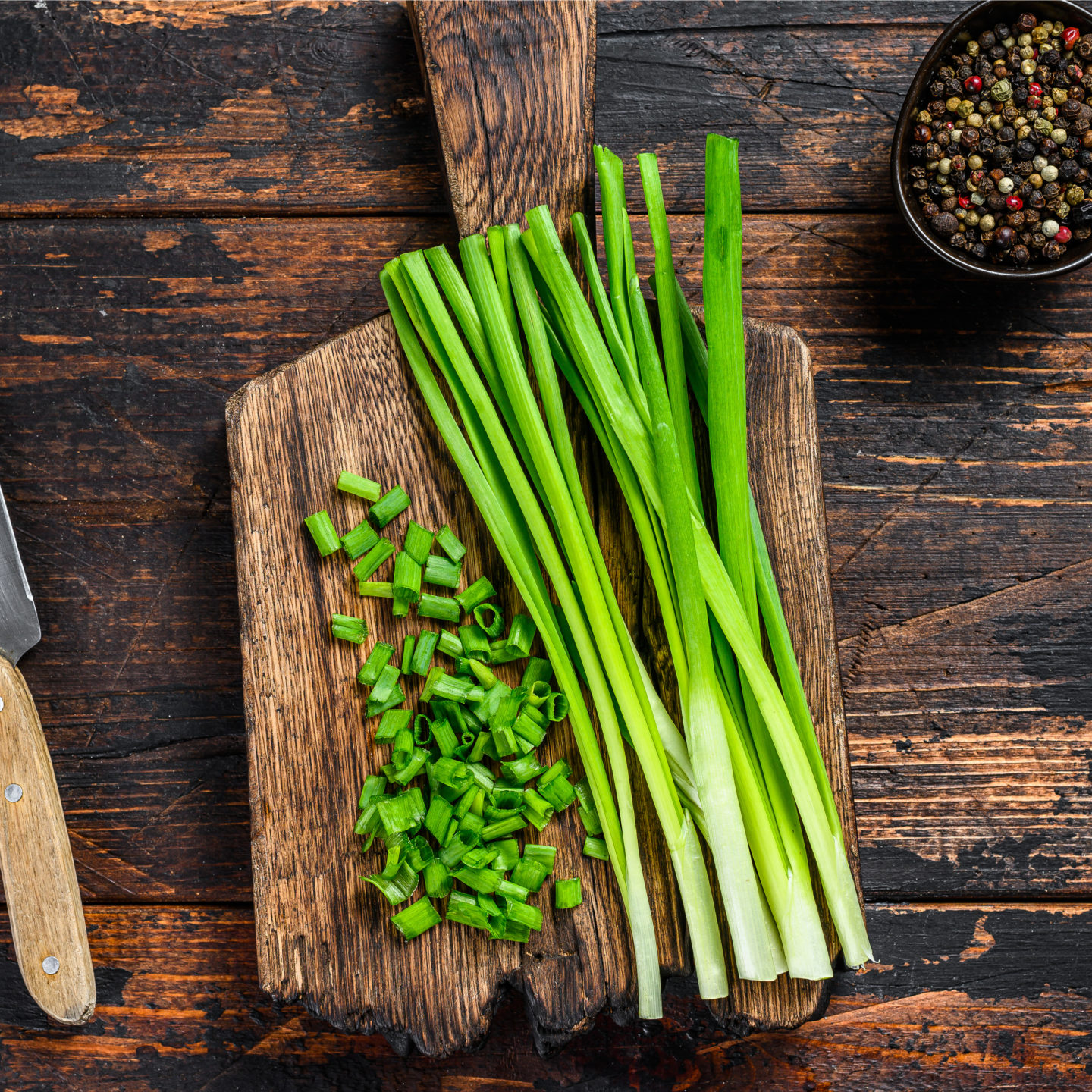 green onions on chopping board