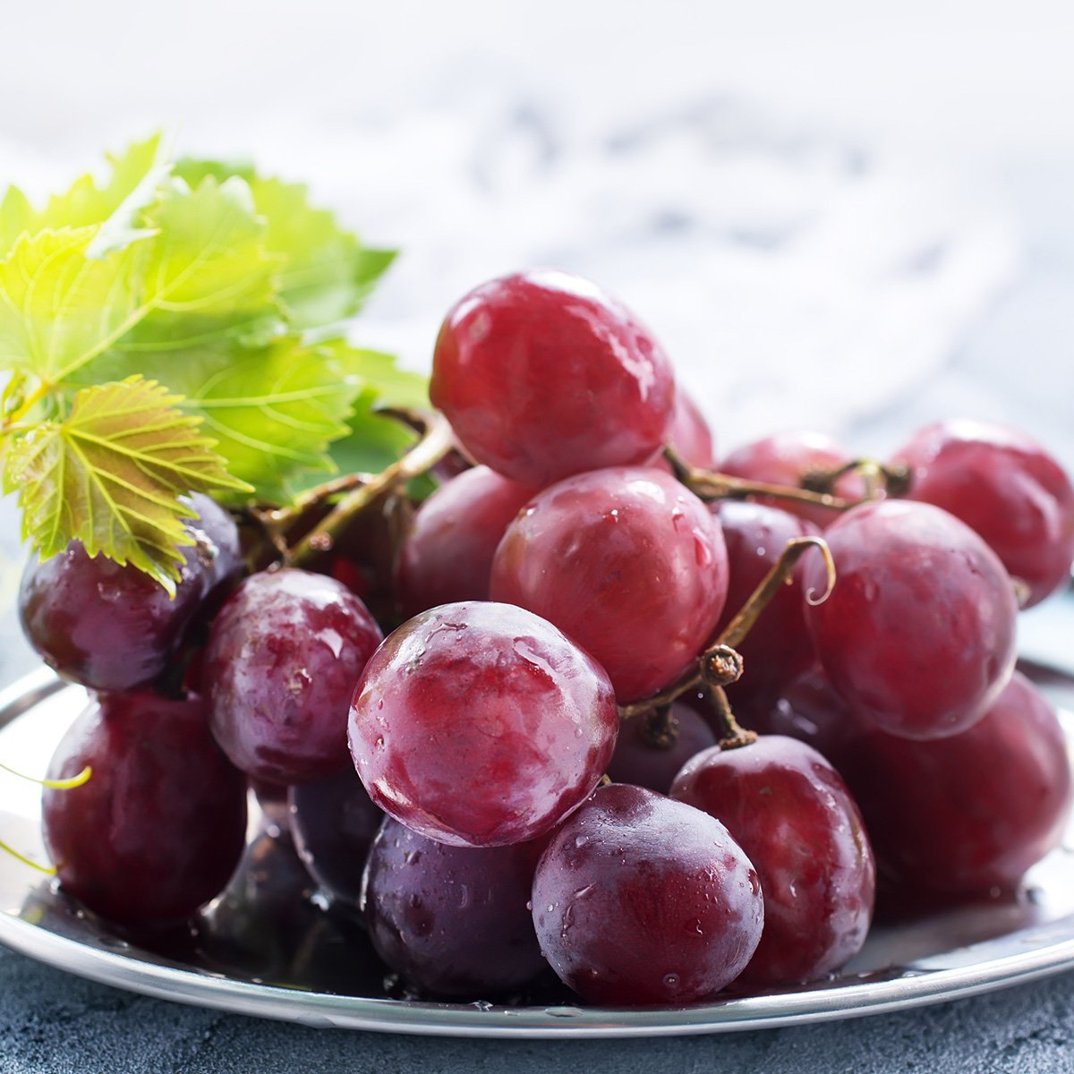 fresh grapes with leafy vine