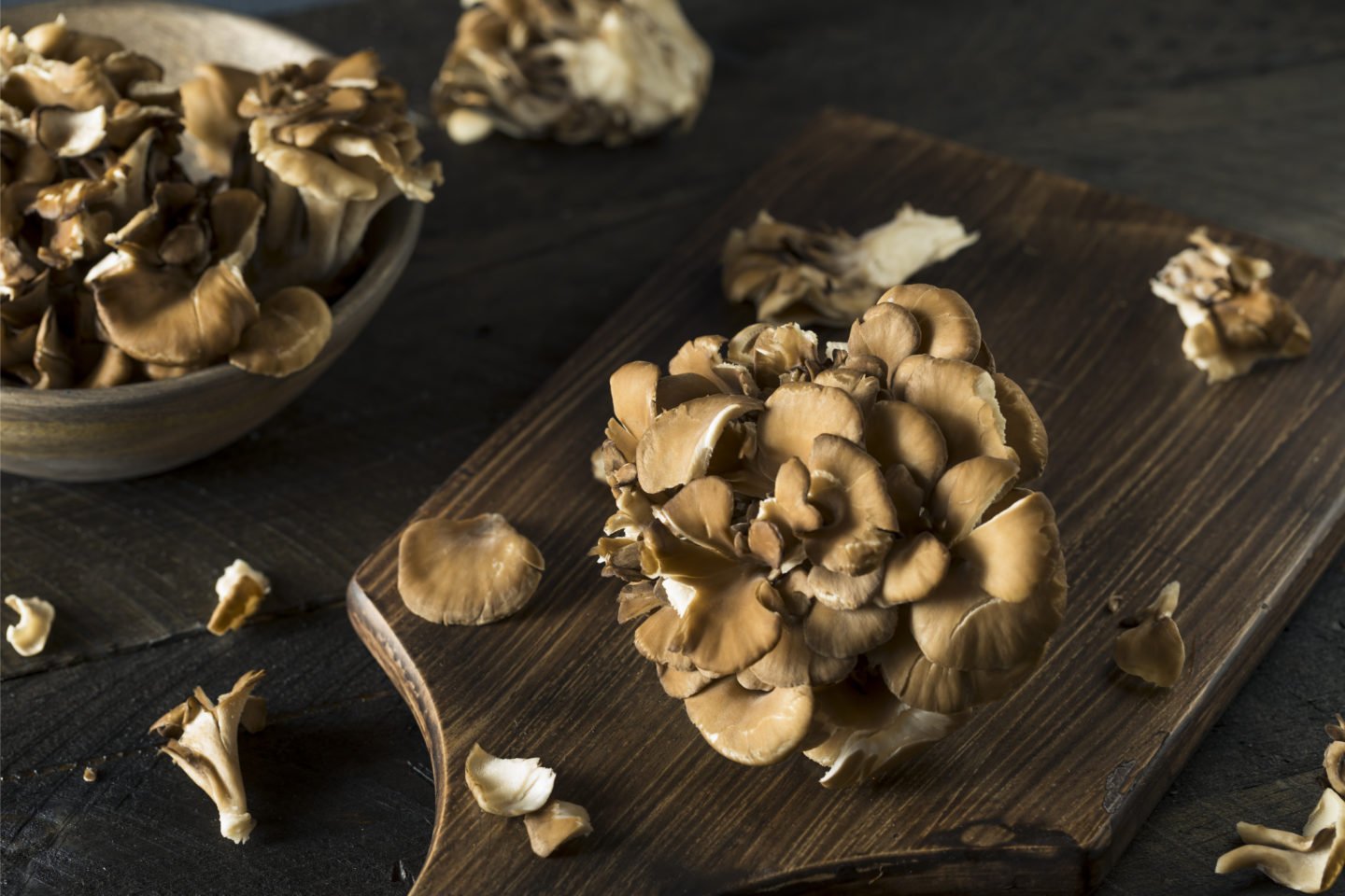 raw maitake mushrooms on cutting board