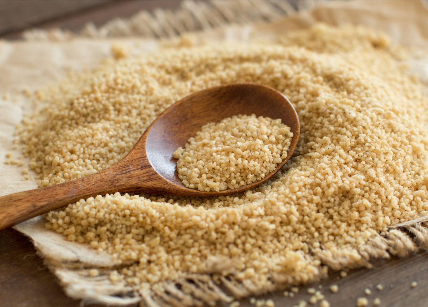 Pile Of Whole Wheat Couscous With Spoon