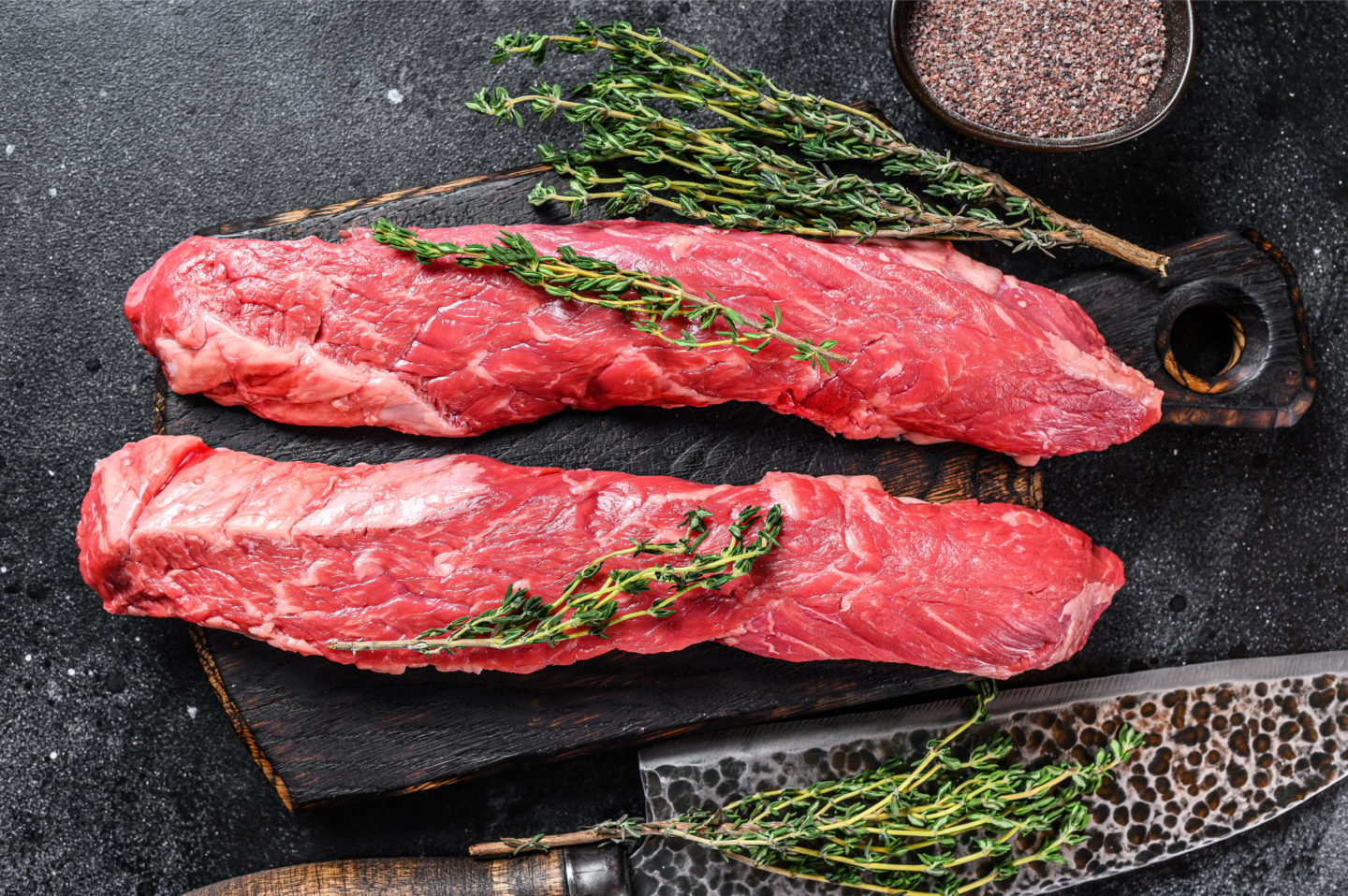 uncooked skirt steak on cutting board