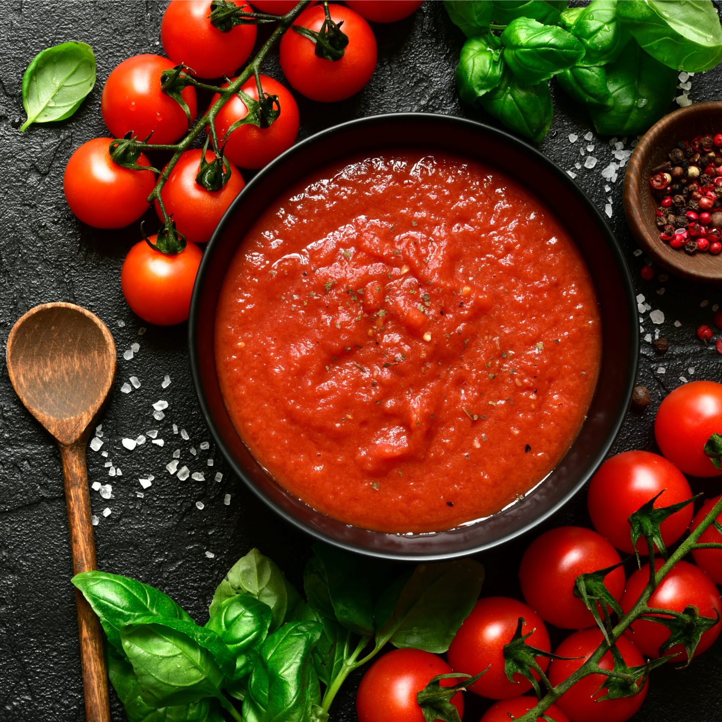 tomato puree in black bowl