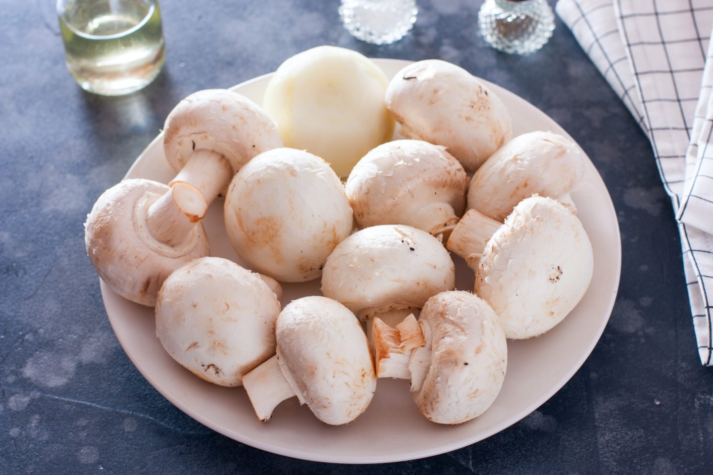 clean white button mushrooms on plate