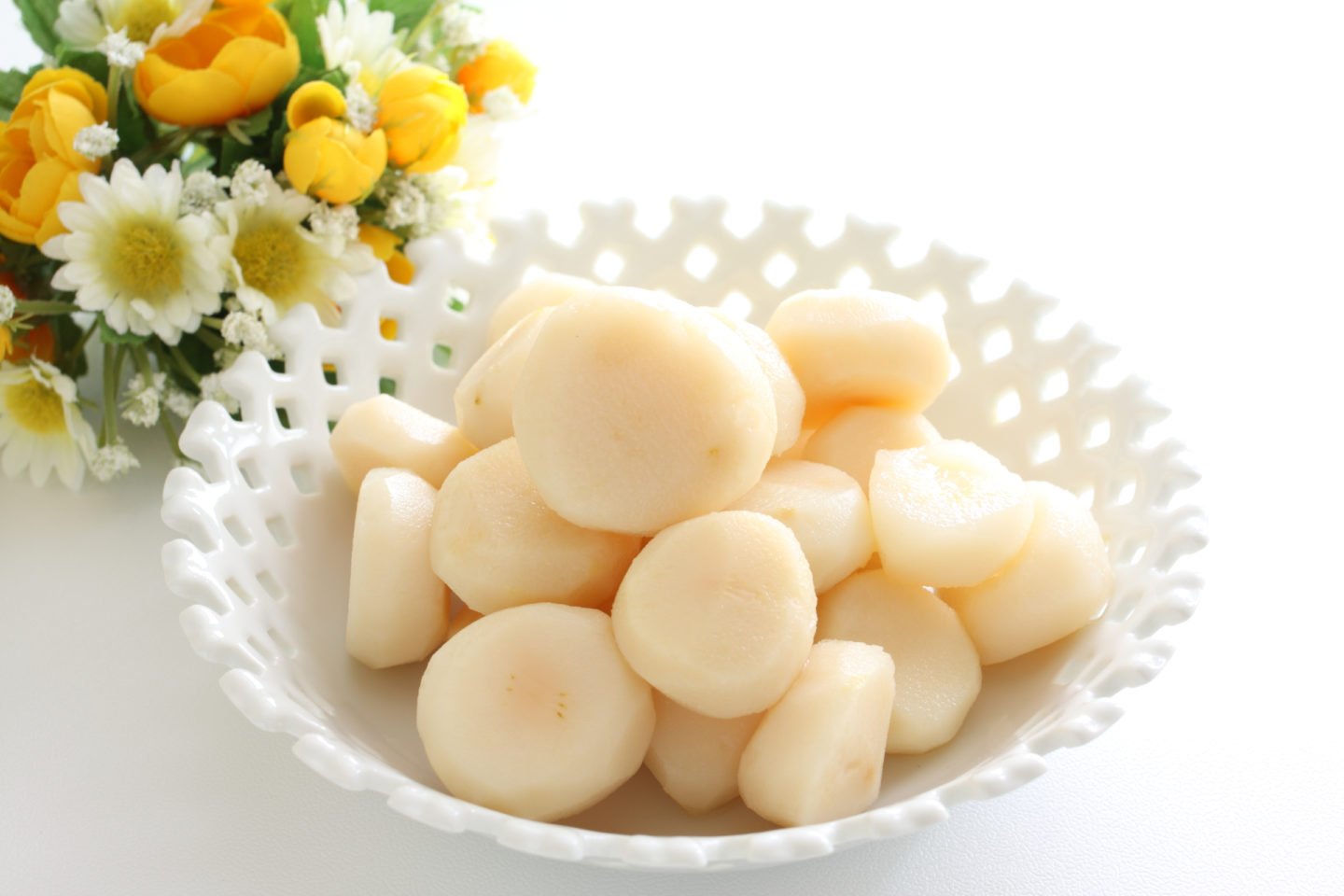whole peeled water chestnuts in white bowl