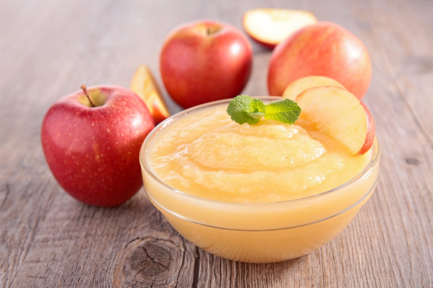 Apple Sauce In Transparent Bowl With Fresh Apples