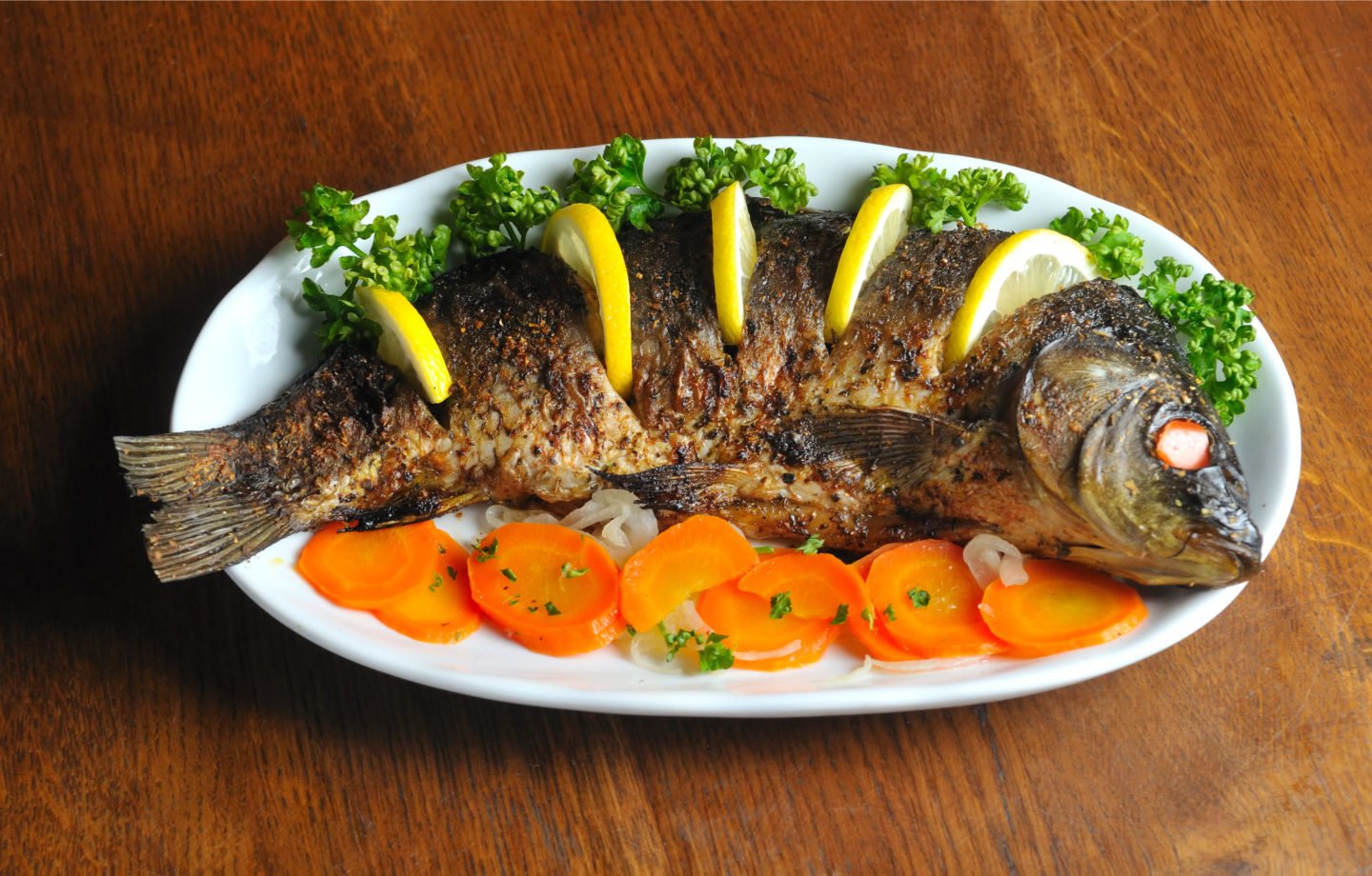 Baked Carp On Plate With Vegetables