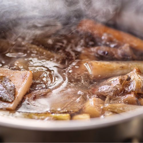 beef broth simmering in pot