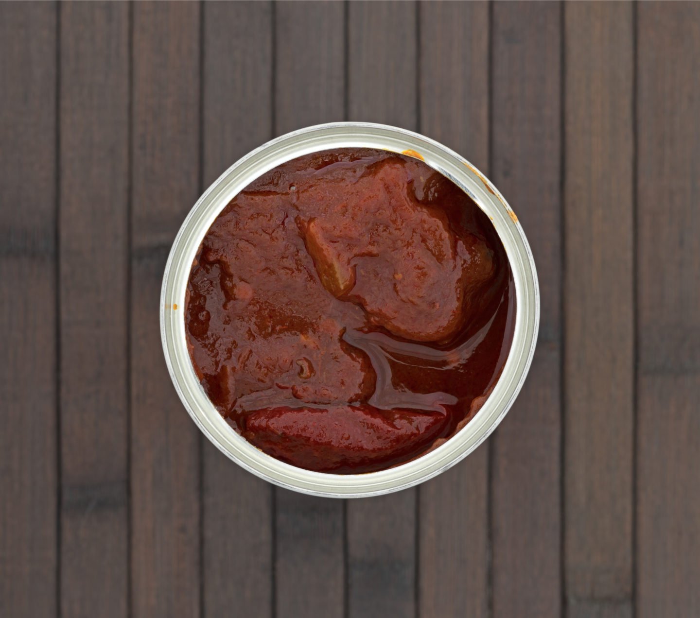 Canned Chipotle Peppers On Wooden Surface