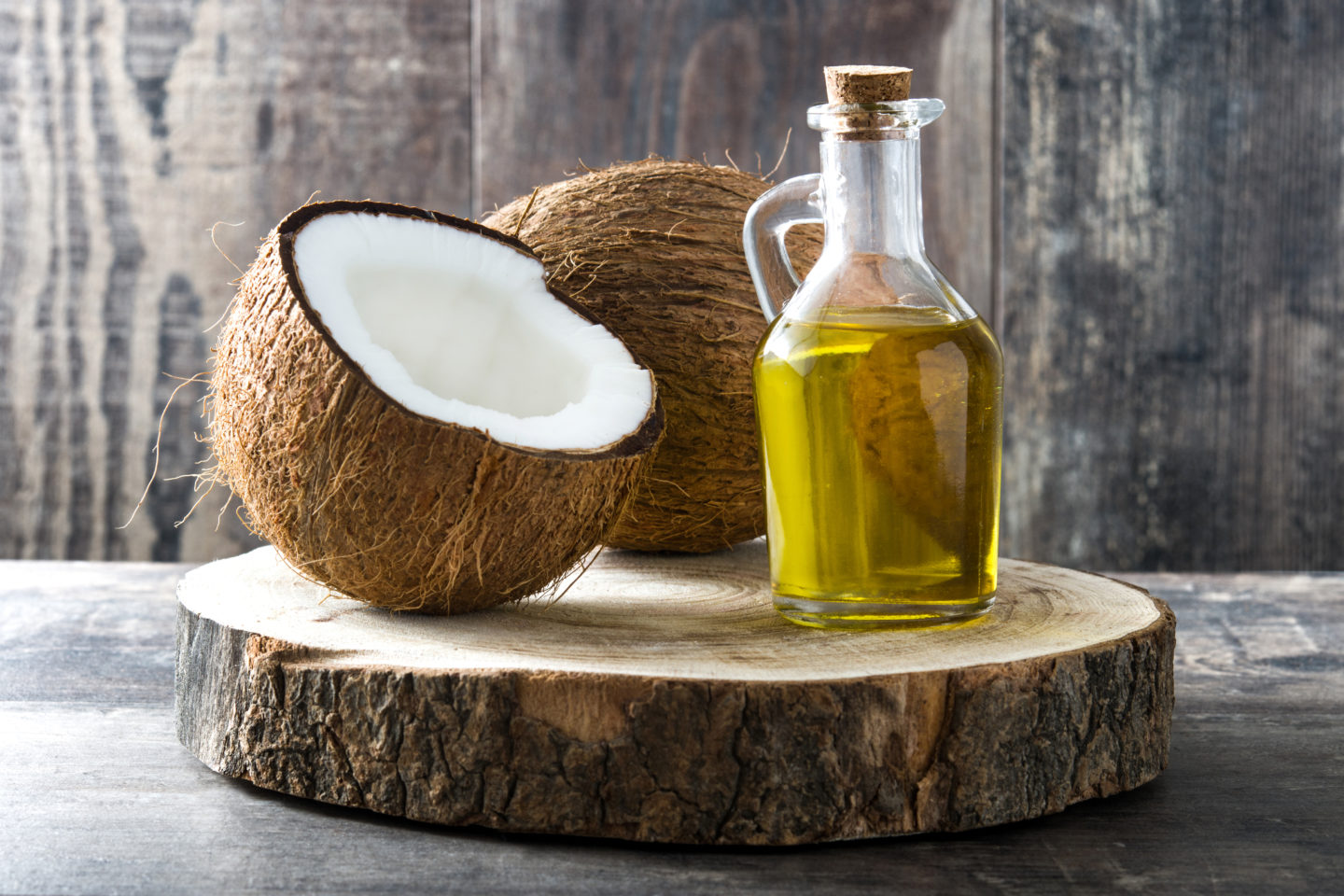 Coconut Oil In Glass Jug On Chopping Board