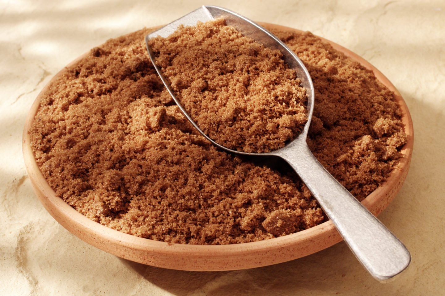 Dark Brown Sugar In Wooden Bowl And Scoop
