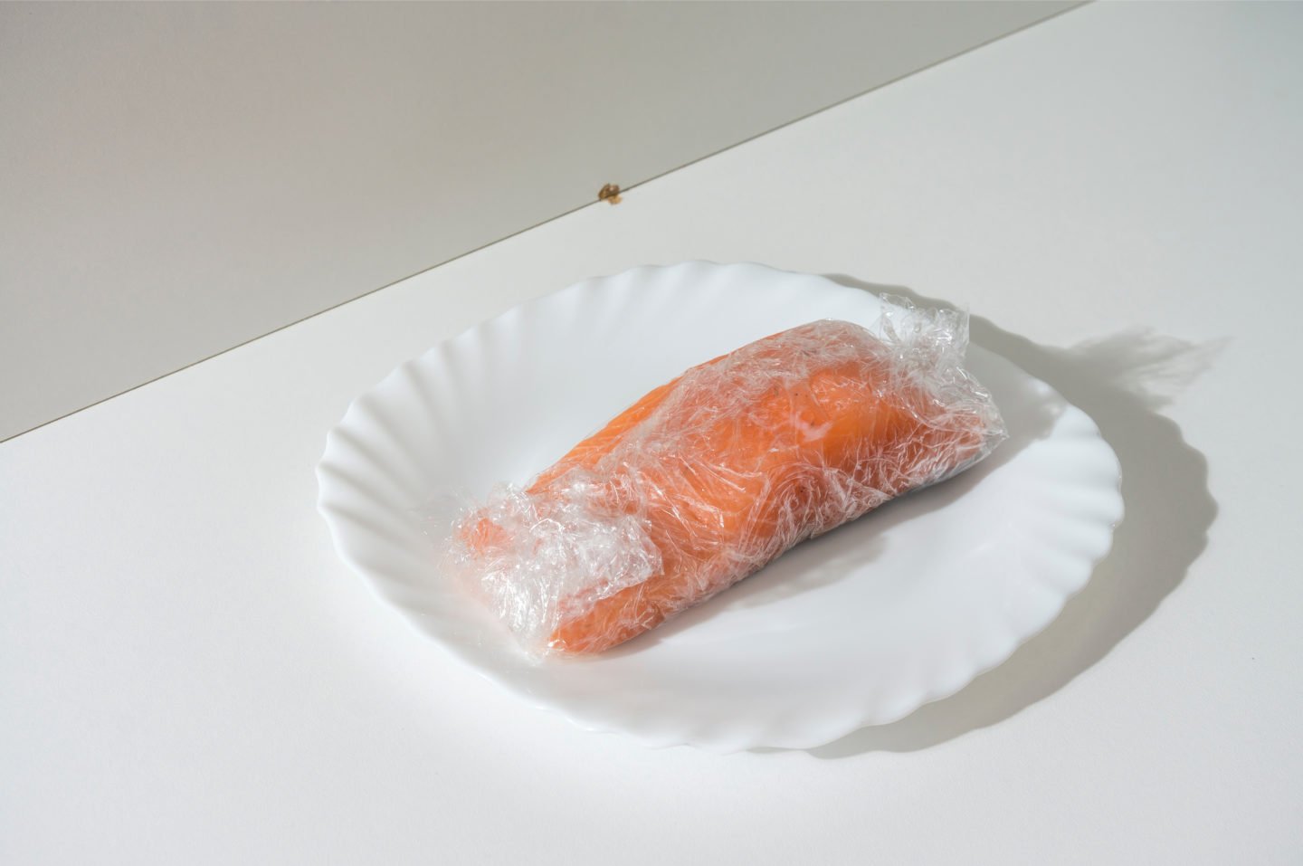 Defrosting Salmon On White Table