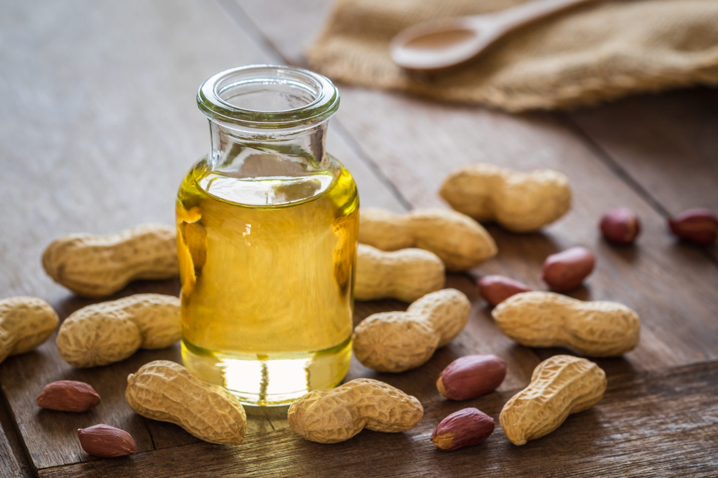 glass bottle full of peanut oil