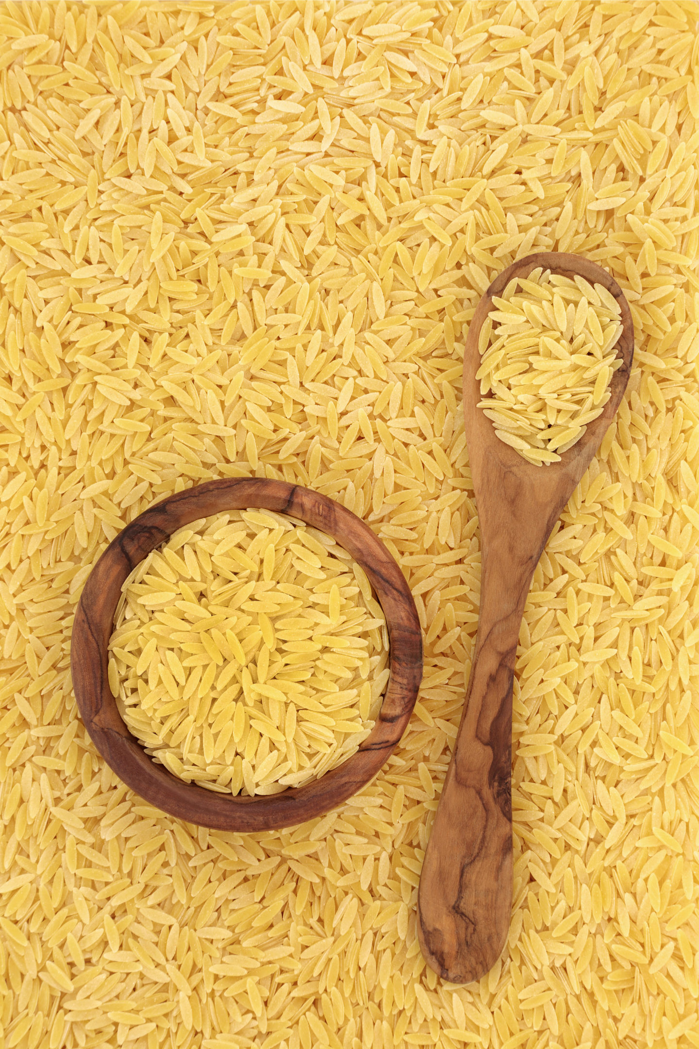 Gluten Free Orzo In Bowl Spoon And Surface