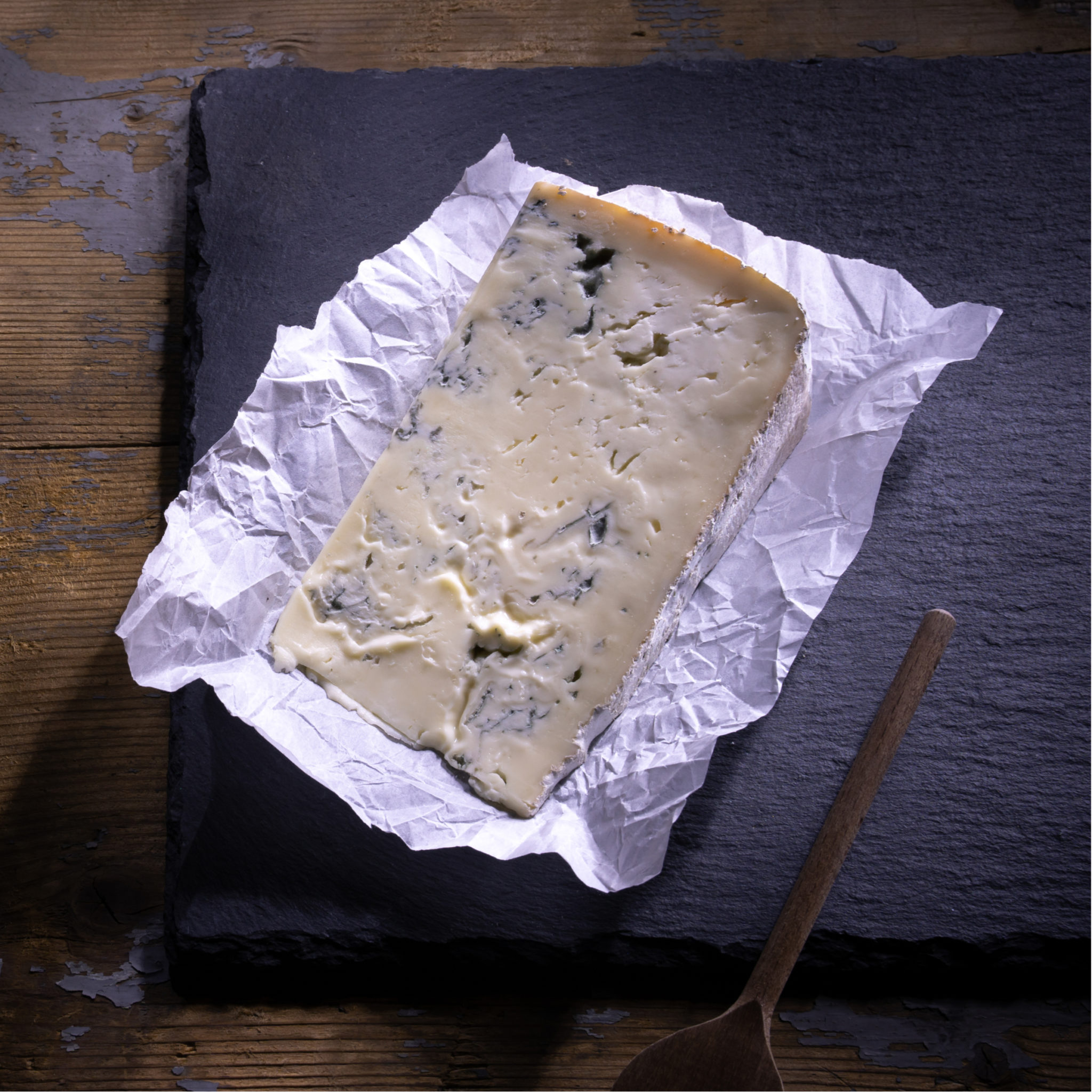 gorgonzola cheese on wooden board